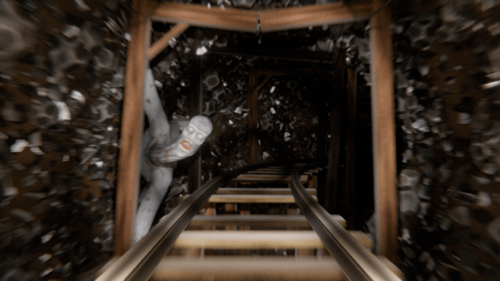 A dark mine shaft with wooden supports and metal tracks, featuring a ghostly figure reaching out from the shadows.